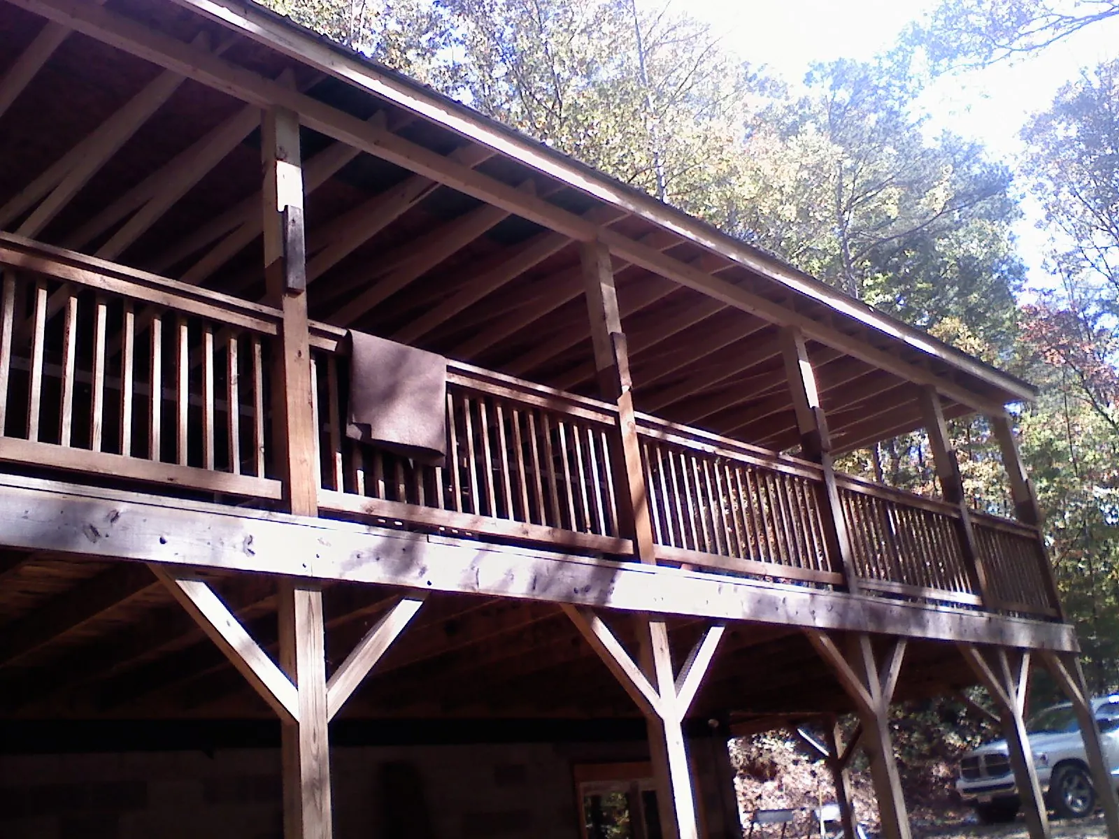 Timber framing under a new elevated porch and deck — Roof Leak Repair in Commerce Township by Roofing Brothers
